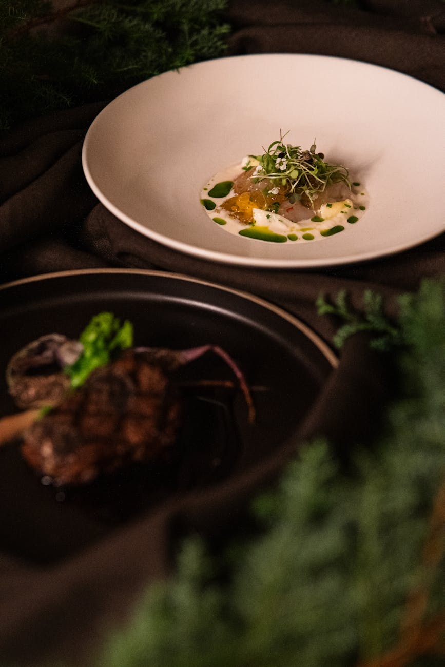 Close-up of elegantly plated fine dining dishes at a Tokyo restaurant, showcasing culinary artistry.